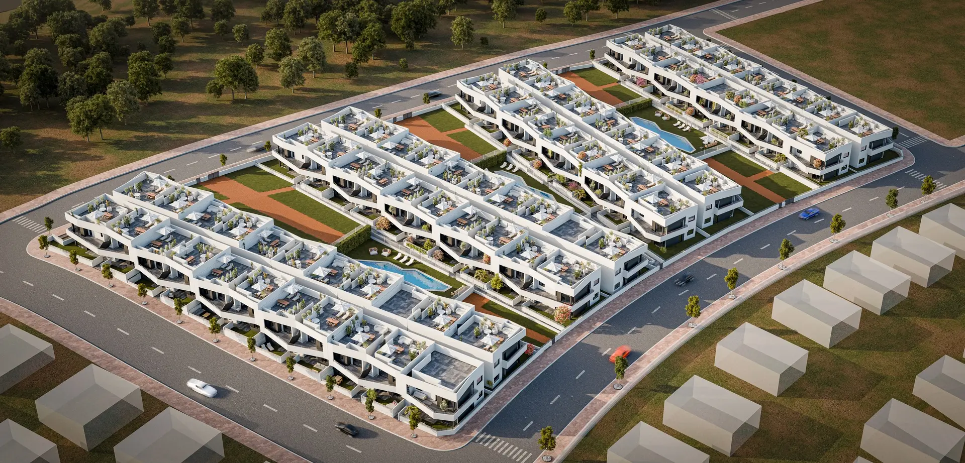 Aerial view of Horizon Resort II showing the terraces of bungalows around the two communal pools