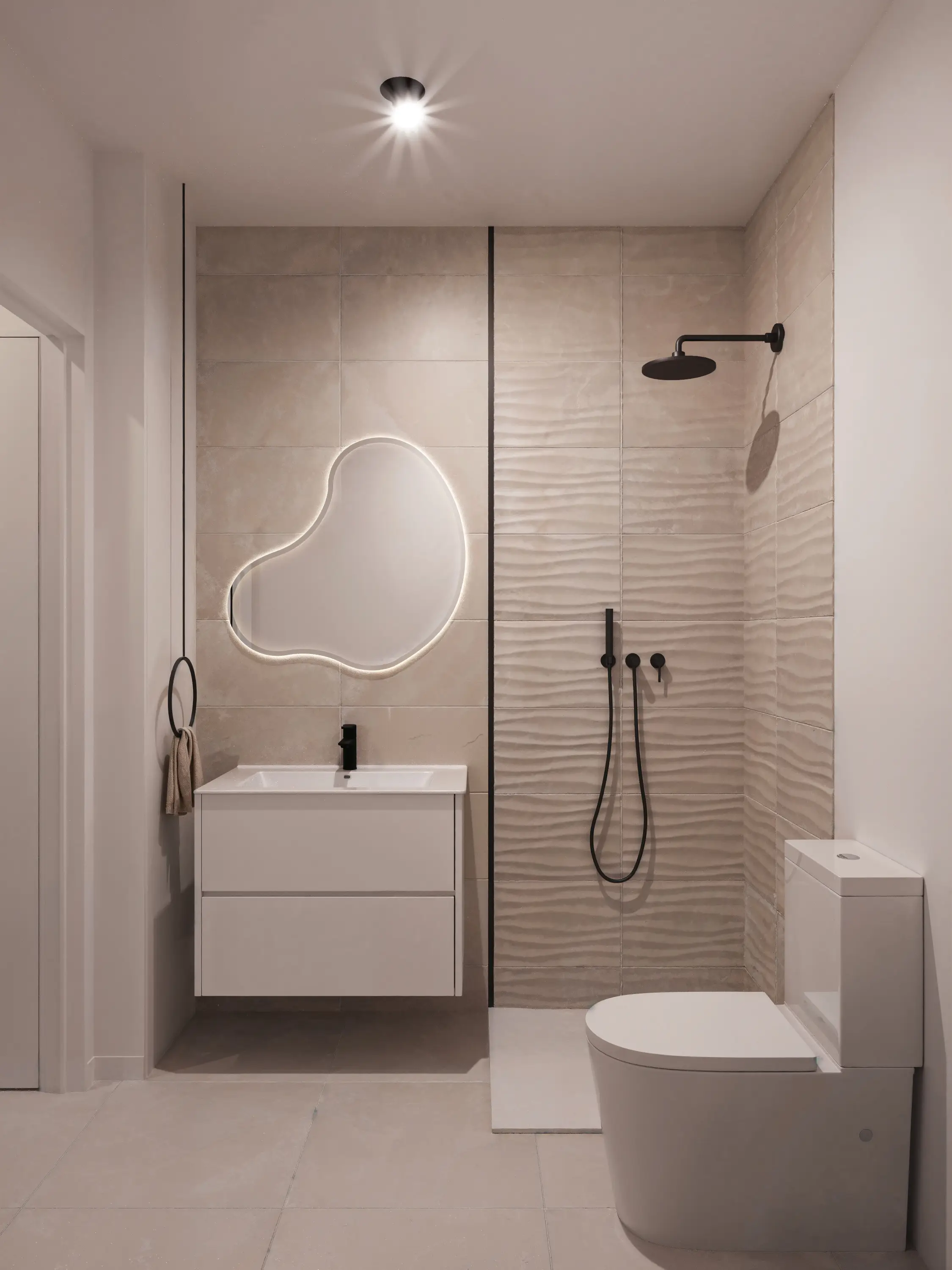 Bathroom with walk-in shower, textured porcelain tiling and a backlit organic mirror