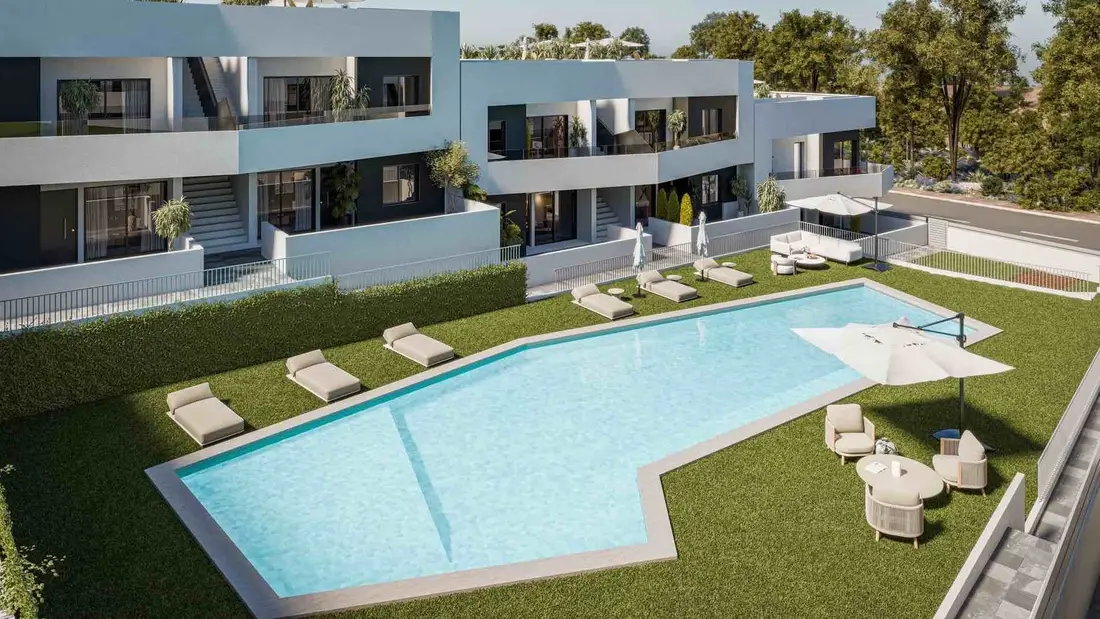 Aerial view over the communal pool and landscaped gardens