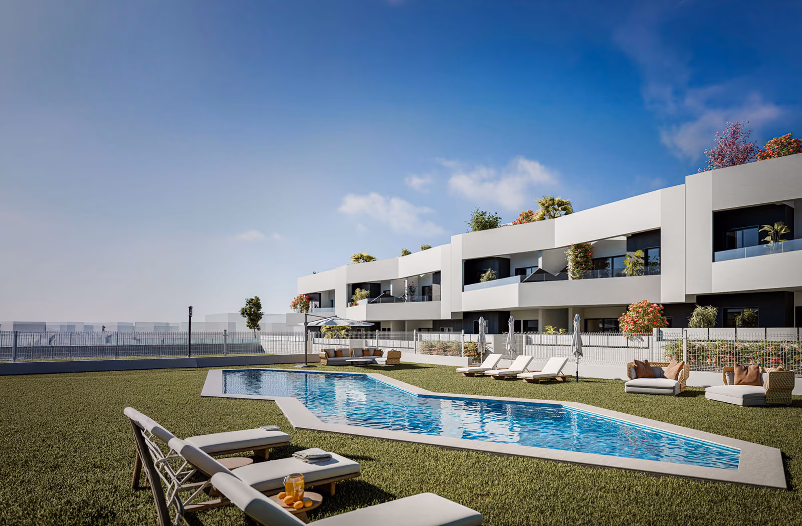 Horizon Resort II, San Miguel de Salinas — the communal pool and lawn, with the new build bungalows and their terraces behind